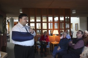 Sporting an arm sling from recent elbow surgery