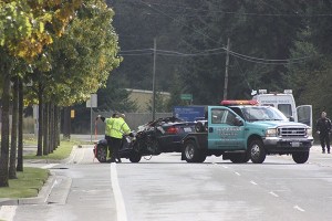Tow-truck drivers attach a vehicle to their truck this morning following a fatality traffic collision in the 19000 block of Union Hill Road. The vehicle was driven by a 22-year-old Bellevue man who died in the accident.