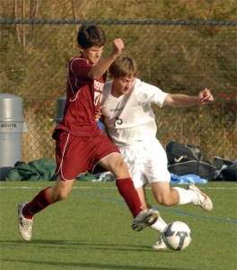 Overlake senior midfielder Sky Tweedie-Yates pushes the ball upfield as Northwest senior Marc’Antonio Undeberg applies some defensive pressure. Tweedie-Yates had two assists in the 7-1 win