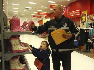 Redmond police officer Jeff Swanson helps Loukia