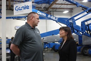 David Jones of Genie Industries (left) and Congresswoman Suzan DelBene discuss how the Redmond company supports Jones as an active member of the U.S. Army Reserves.