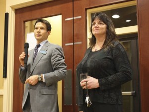Vice president and branch manager of Columbia Bank in Redmond Greg Todd (left) says a few words to the crowd at the branch's ribbon cutting ceremony Thursday evening. The event celebrated the opening of Columbia's new location at 16200 Redmond Way. The new location will have all of the same employees from the previous location