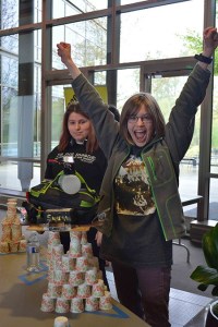 An attendee at the City of Redmond's Girl Unlimited celebrates her tower of power.