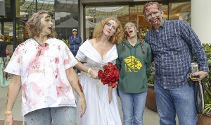 Zombies hang out at Redmond Town Center last Saturday during the Thrill the World event.