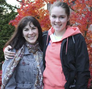 Kristen and Mekenna Mossman outside a local coffee shop following cross-country practice on Monday.