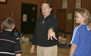 Dan Shelhamer of Studio East directs a rehearsal of 'Around the World in 80 Hours' featuring students from Rose Hill Elementary School. Performances will be held Jan. 15 and 16 at Rose Hill Junior High School in Redmond. For information