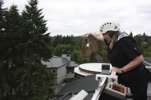 Albert Einstein Elementary School's physical education specialist Cheryl Plate prepares to launch a student-made contraption during the school's first-ever Egg Drop Thursday afternoon.