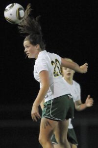 Redmond High's Andrea Larson heads the ball during Tuesday's 4-1 win against Garfield. Larson scored two goals as the Mustangs earned their first 4A Kingco win of the season.