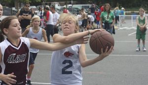 Girls battle for the ball during last Friday's 3-on-3 basketball tournament at Redmond's Great Day of Play on the City Hall campus.