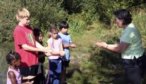 Clay Heilman of Redmond-based Nature Vision leads a recent nature field trip.  The award-winning non-profit is expanding its nature and living history programs to teach kids and families about sustainability.