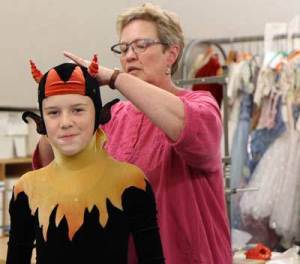 It's costume-fitting time for Caelen Wisont.