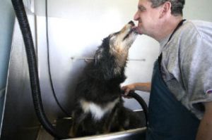 Ron Soukup grins as his dog