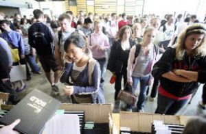 ABOVE: Seniors line up to pick up their yearbooks in the cafeteria at Redmond High School last Wednesday. BELOW: Megan Dearden
