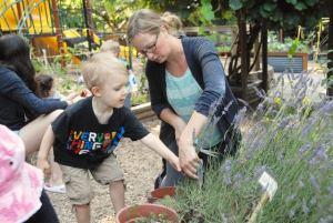 Katherine Stewart gardens with a student at Montessori Children’s House in Redmond. Courtesy of Montessori Children’s House