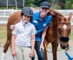 Participant Emma Coopersmith (left) and instructor Jane Chapin are all smiles with Star the horse at Little Bit Therapeutic Riding Center’s annual horse show. Courtesy of Sugar Sand Photography.