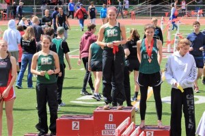 Bear Creek’s Olivia Markezich stands atop the victory podium for the 3
