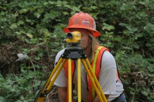 A King County sewer utility survey crew member works along the Sammamish River Trail. Courtesy photo