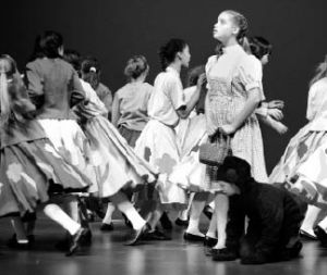 Sarah Oates performs as Dorothy as the Munchkins run away from her when The Wicked Witch appears during a dress rehearsal of Oz.