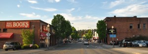 Now and then: Above photo is facing northeast on Leary Way today. Below photo is from the same position during a July 4 parade in 1911. The Redmond Trading Company building on the left is now home to Half Price Books. Courtesy of the City of Redmond and Eastside Heritage Center