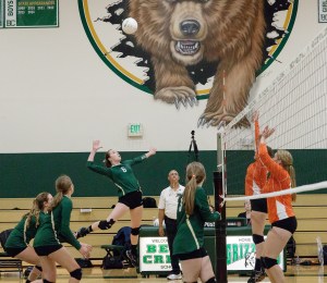 Bear Creek’s Abby Campbell swings outside while Camille Decker and Alyssa Marcus cover during Monday’s 1A Emerald City League match against Overlake
