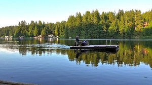 Paul and Susan Gorman sit on their handmade watercraft on Ames Lake near Redmond. It was initially a float