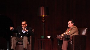 Canon Andrew White (left) points to an audience member at The Bear Creek School during his talk as the Rev. Jeff Gephart looks on Wednesday evening.