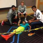 A young participant (center) volunteers to be part of a crime scene at a STEM for Fun workshop at the Kirkland Library.
