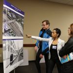 Leah Ephrem (center), a principal with Hewitt Architects staff discusses East Link with open house attendees. Samantha Pak, Redmond Reporter