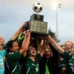 Overlake girls soccer players hoist the 1A state championship trophy after Saturday&rsquo;s 3-0 victory over La Salle. Andy Nystrom, Redmond Reporter