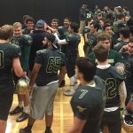 Redmond High football players and coaches gather after their final game to share their feelings about the Mustangs&rsquo; season and display team brotherhood. Courtesy of Peg Jatekar