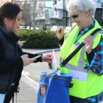 Deanna Beglyarova, 18, casts her first general election ballot this morning at Redmond City Hall, which featured a drive-up ballot box and one for walk-ups. Mary Becker, right, of King County Elections was in charge of the walk-up box. Andy Nystrom, Redmond Reporter