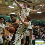 Redmond&rsquo;s Aleks Bober (4), Carson Brown (3) and Devon La Pierre (10) surround Mercer Island&rsquo;s Giovanni Cervantes-Rocha during Tuesday night&rsquo;s game. Mercer Island won, 71-68, in double overtime. Andy Nystrom, Redmond Reporter
