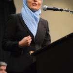 Top, Aneelah Afzali, executive director of the Muslim Association of Puget Sound&rsquo;s American Muslim Empowerment Network, speaks at Monday&rsquo;s Hate Free Zone rally in Seattle. Left, attendees hold signs during Gov. Jay Inslee&rsquo;s speech. Andy Nystrom,                                 Redmond Reporter