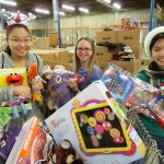 Stella Schola students and alumni volunteered one Saturday to wrap holiday gifts for families in need. Courtesy image