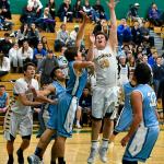 Redmond&rsquo;s Graham Sheffer (20) drives to the hoop against Interlake. Courtesy of Marc La Pierre