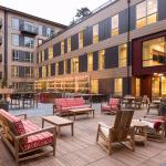 Located within walking distance of restaurants, bars, parks and the Sammamish River Trail, The Carter on the Park also features The Heartwood &mdash; an interior courtyard with community fire place gathering area, outdoor ping-pong table, shuffleboard, grilling station and creative lighting. Courtesy of MainStreet Property Group