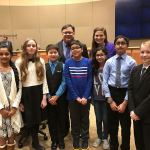 Redmond Mayor John Marchione (back left), with Evergreen Middle School sixth-graders, from left, Piya Modalavalasa, Sophia Collins, Hayden Daniels, Jesus Ramirez, Faria Rashid, Manovay Sharma and Derek Thorp and one of their teachers Kerry Hanson at Tuesday&rsquo;s City Council meeting. Courtesy photo