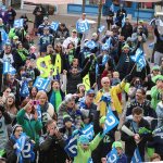 Seattle Seahawks fans and mascot Blitz cheer on their team at today&rsquo;s rally at Redmond Town Center. The Seahawks will play at Atlanta tomorrow in an NFC divisional playoff game. Andy Nystrom, Redmond Reporter