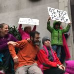 Youngsters hold up signs for marchers in downtown Seattle during the Women&rsquo;s March on Seattle. Samantha Pak, Redmond Reporter