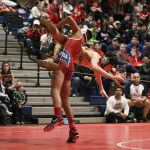 Juanita&rsquo;s King Kotalas throws Redmond&rsquo;s Nadav Levanoni in the finals of the 113-pound weight bracket at the Class 2A/3A KingCo Conference championships on Saturday at Juanita High School in Kirkland. JOHN WILLIAM HOWARD/Kirkland Reporter