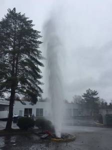 The water has been capped and repairs are underway on this hydrant that was struck by a car this afternoon. Courtesy of the Redmond Police Department