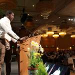 Seattle Seahawks defensive end Tylor Harris encourages Celebration of Youth luncheon attendees to contribute financially to support Friends of Youth. Samantha Pak, Redmond Reporter
