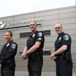 From left, Sgt. Patty Neorr, Sgt. Steve Lincoln and Lt. Tim Gately with the Redmond Police Department&rsquo;s new patch. Samantha Pak, Redmond Reporter