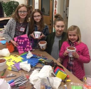 Volunteers work away during St. Jude Service Day last month.
