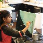 Ira Ganjikunta, 6, works on a painting at her Redmond home. CATHERINE KRUMMEY/Kirkland Reporter