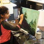 Ira Ganjikunta, 6, works on a painting at her Redmond home. CATHERINE KRUMMEY/Kirkland Reporter