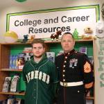 Cameron Allenshipman (left) and U.S. Marines Gunnery Sgt. Daniel Dinsmore in the career center at Redmond High School. Samantha Pak, Redmond Reporter