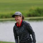 Mandy Demerse is all smiles after putting out on the 18th hole. Andy Nystrom, Redmond Reporter