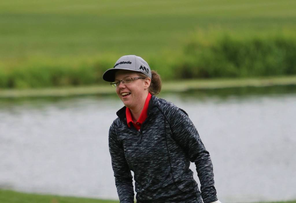 Mandy Demerse is all smiles after putting out on the 18th hole. Andy Nystrom, Redmond Reporter
