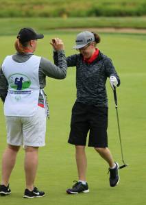 Pleased with her putt at Special Olympics golf championship